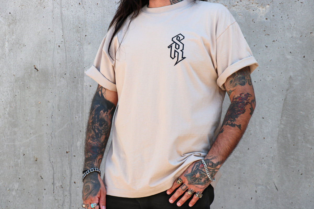 Cornerstone Tee front – SR monogram chest logo on sand heavyweight oversized tee